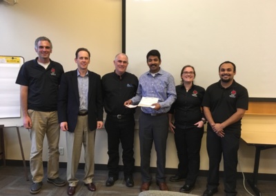 GEW's Managing Partner Brian Clarke presenting a check to Central WA University's Safety Health Management program to fund the Dr. Patton's scholarship (founder of Safety program at CWU and advisor to Clarke).