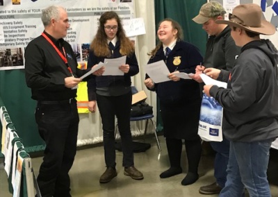 Partners Brian Clarke and Duane Grange at Willamette AG Expo testing local FFA students on their knowledge of the Food Safety Modernization Act.